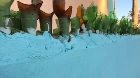 Broken bottle fence Stock Footage 106894888