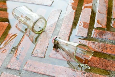 Broken bottle on the ground Stock Photos