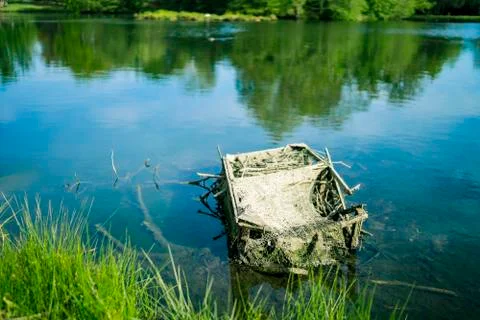 Broken box in lake Stock Photos
