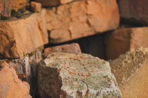 Broken bricks dumped into a pile for construction Stock Photos