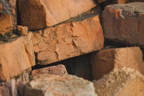 Broken bricks dumped into a pile for construction Stock Photos