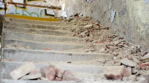 Broken bricks lie on the old stairs - messy interior Stock Footage 55703027