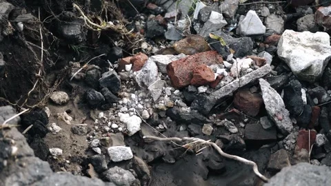 Broken bricks, stones and other construction debris are piled together Stock Footage 338347339
