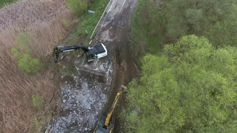 Broken bridge, crawler excavator at rivers broken road structure destroyed road 스톡 동영상 156682829