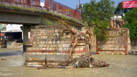 Broken bridge over flowing river Видео 321039267