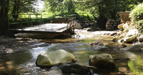 Broken bridge over mountain creek Stock Footage 139655206