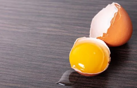 Broken brown chicken egg Stock Photos