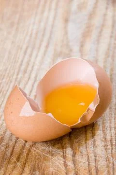 Broken brown egg Stock Photos