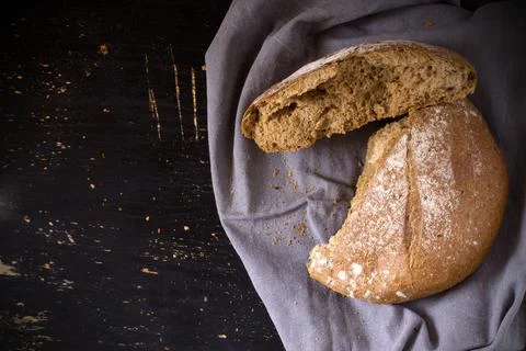 Broken buckwheat bread on dark background Stock Photos