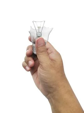 The broken bulb in a hand  Isolated on white background Foto stock