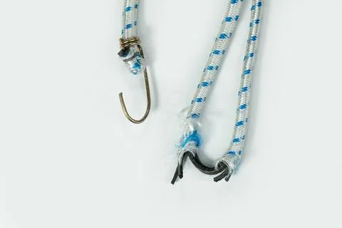 Broken Bungee rubber rope with hooks Stock Photos