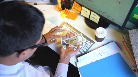 Broken businessman checking his wallet with low money Видео 142497607