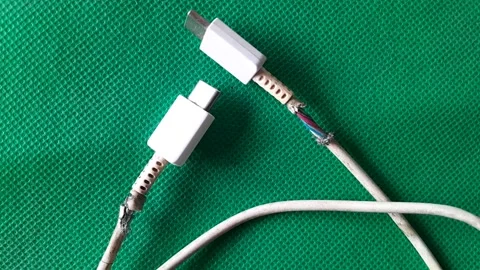 Broken Cable Charger Connection to Electronic Stock-Footage 311430641