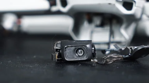 Broken camera of a drone on a black surface Stock Footage 145169804