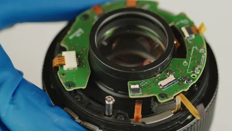 Broken camera lens in hands of master. Close up. Stock Footage 181233912