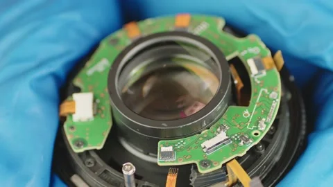 Broken camera lens in hands of master. Close up. Unrecognizable person in gloves Stock Footage 181960711