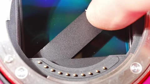 Broken camera shutter repair process at a tech workshop Stock Footage 308526050