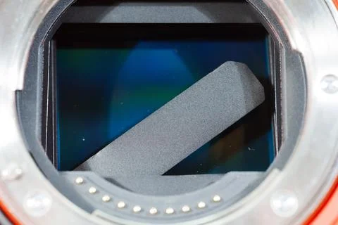 Broken camera shutter reveals internal sensor mechanism during repair Stock Photos