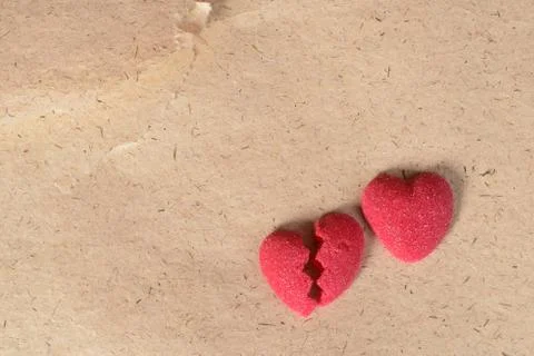 Broken candy heart on paper Stock Photos