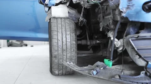 Broken car close-up in the garage. After an accident Stock Footage 165836225