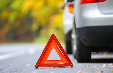 Broken car concept, breakdown triangle on road Stock Photos