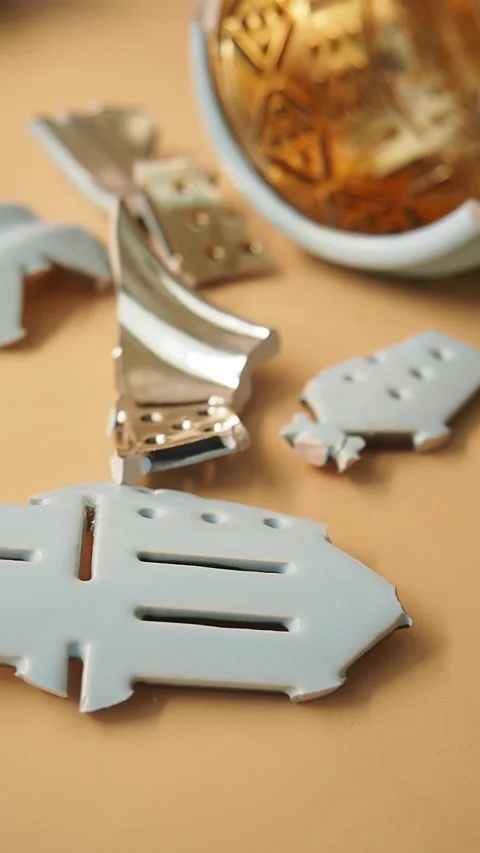 Broken Ceramic Pieces on a Table Stock Footage 348337786