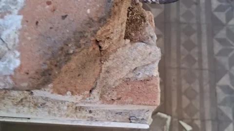 Broken ceramic tile fragments lying on patterned floor video footage Stock Footage 337897055