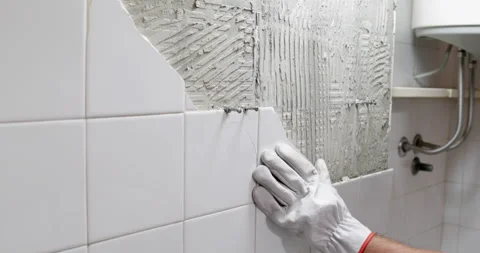 Broken ceramic tile removing closeup Stock Footage 327754621