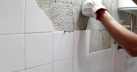 Broken ceramic tile removing closeup Stock Footage 327754661