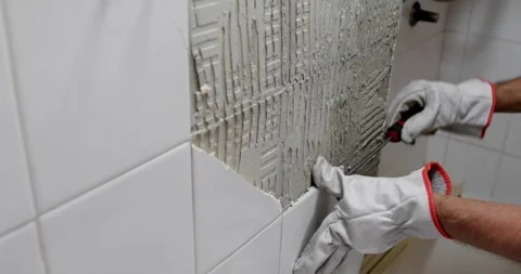 Broken ceramic tile removing closeup Stock Footage 327754794