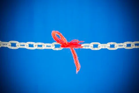 Broken chain connected with red threads Stock Photos
