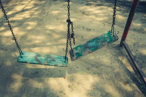 Broken chain swing. Stock Photos