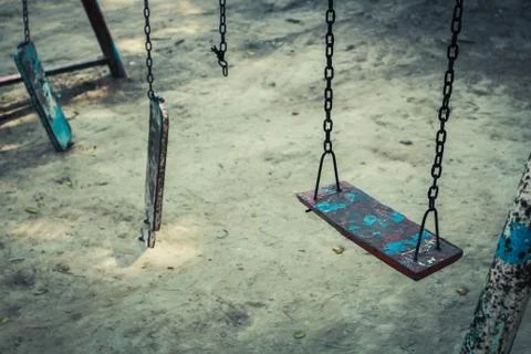 Broken chain swing. Stock Photos