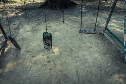 Broken chain swing. Stock Photos