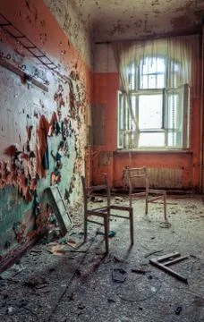 Broken chairs in decayed interior of Sanatorium Teupitz, Brandenburg, Germany Stock Photos