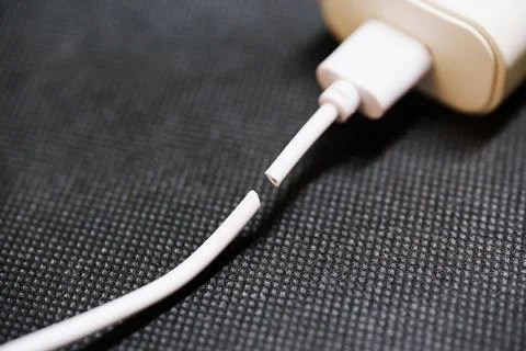 Broken charging cable disconnected from power adapter Фото