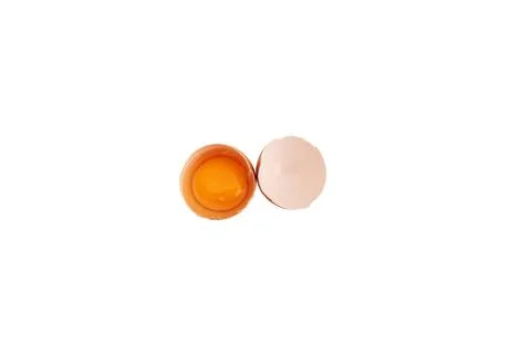 Broken chicken egg on a white background. Stock Photos