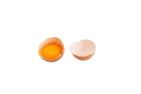 Broken chicken egg on a white background. Stock Photos