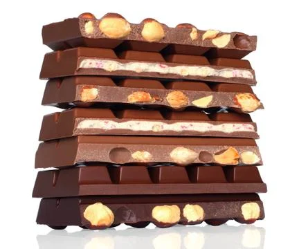 Broken chocolate bars with nuts Stock Photos