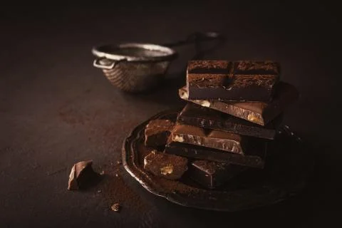 Broken chocolate pieces Stock Photos