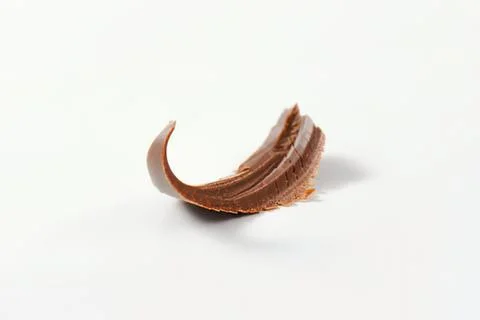 Broken chocolate shell on plain background Fotos de archivo