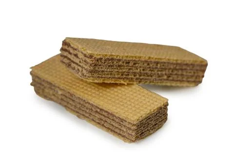 Broken chocolate wafer bars on white background Фото