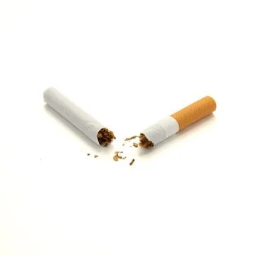 Broken cigarette in half with orange filter isolated on white background Stock Photos