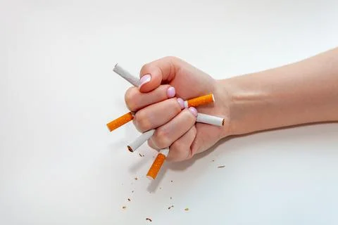 The broken cigarette on hand. Winning with addicted nicotine problems Stock Photos