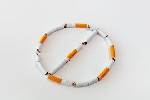 Broken cigarette on a white background. Broken cigarettes Stock Photos