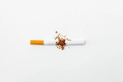 Broken cigarette on white background. Stock Photos