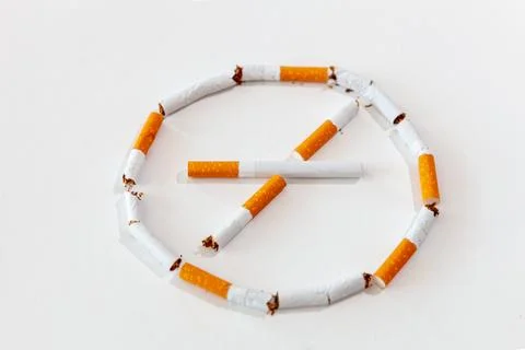 A broken cigarette on a white background. Foto stock