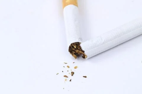 Broken cigarette on white background. Stop smoking concept. Stock Photos
