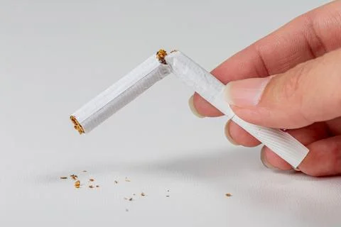 Broken cigarette on white background. World no tobacco day and lung health .. Stock Photos