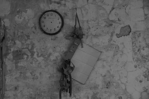 A broken clock on the wall of the high school in Pripyat, Chernobyl 写真素材